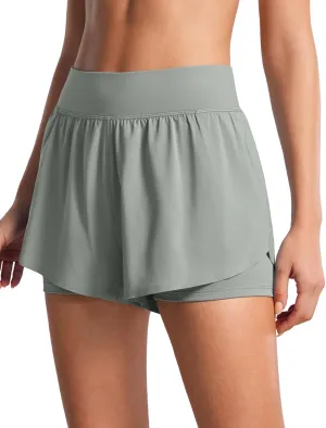 CRZ YOGA 2 in 1 Dolphin Running Shorts for Women High Waisted Gym Workout Athletic Tennis Shorts with Pockets Split